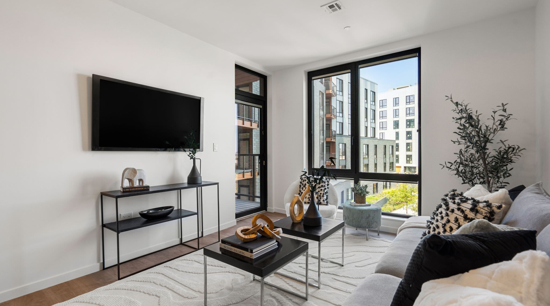 living area with large window and decorations