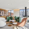 a lounge with chairs and tables