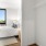 a bedroom with a large mirror
