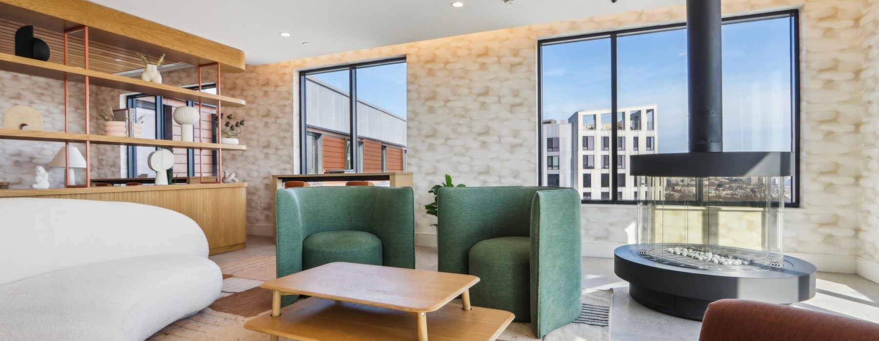 clubroom with chairs tables and large windows