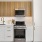 a kitchen with white cabinets