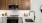 a kitchen with wooden cabinets