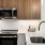 a kitchen with wooden cabinets