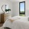 a bedroom with a large mirror