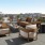 a patio with a couch and chairs