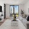 a living room with a tv and couches